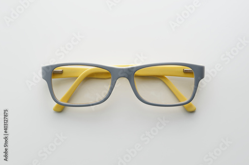 Eyeglasses with gray and yellow frame.