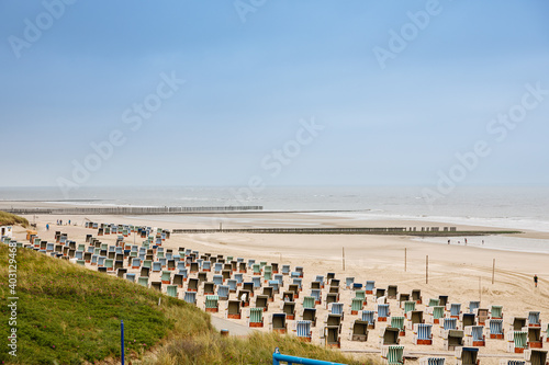 Beach with many beach chairs on a North Sea island. Beach on a North Sea island