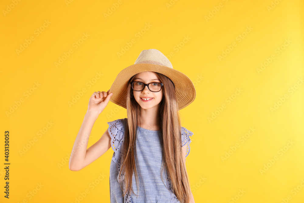 Portrait of cute little girl on yellow background Portrait of cute little girl on yellow background