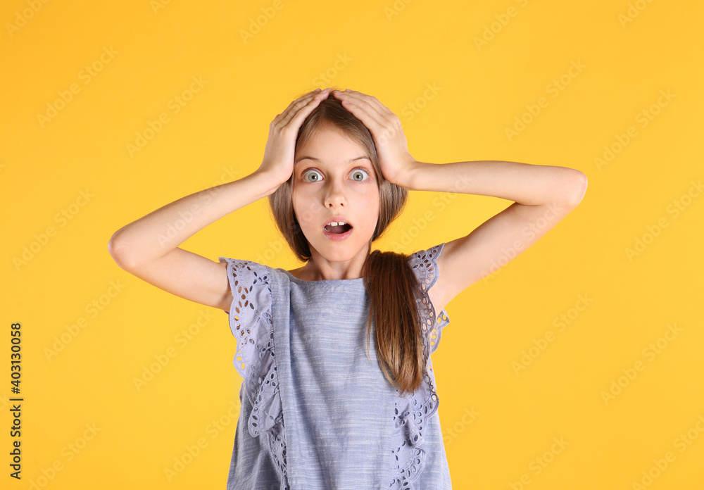 Portrait of emotional little girl on yellow background Portrait of emotional little girl on yellow background