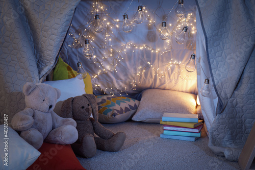 Slika na platnu Play tent with toys and pillows indoors, closeup