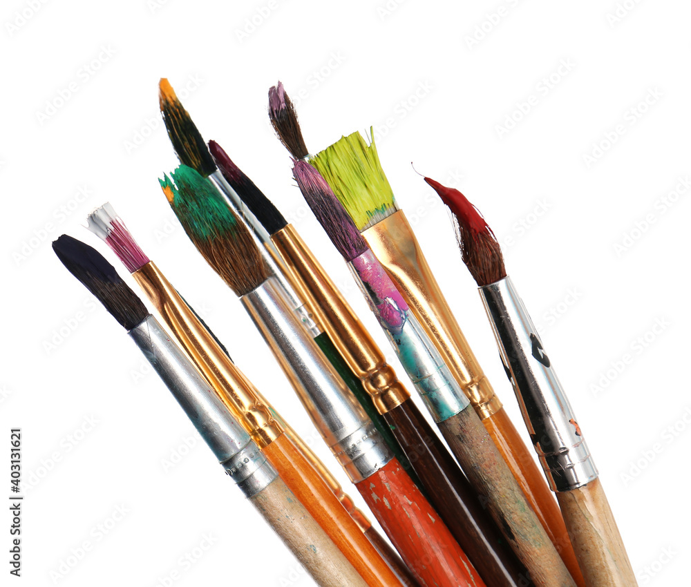 Obraz premium Different brushes with paints on white background