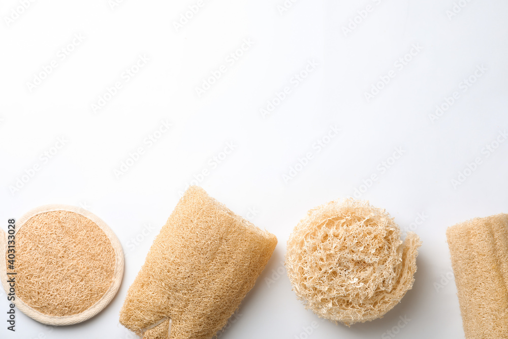 Natural shower loofah sponges on white background, top view Natural shower loofah sponges on white background, top view