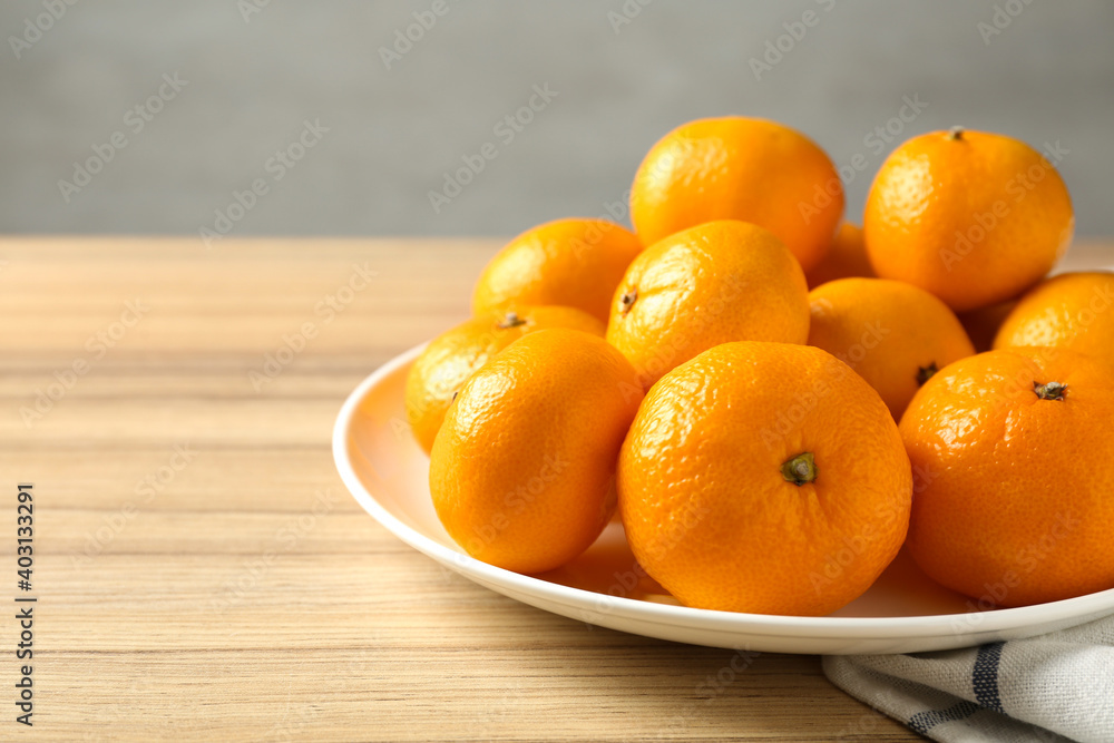 Fresh tangerines on wooden table. Citrus fruit Fresh tangerines on wooden table. Citrus fruit