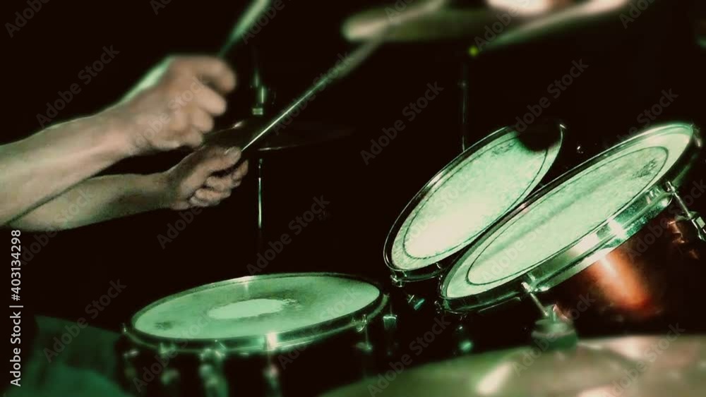 To play on drums. Musical dark background. Drum kit in slow motion. To play on drums. Musical dark background. Drum kit in slow motion.