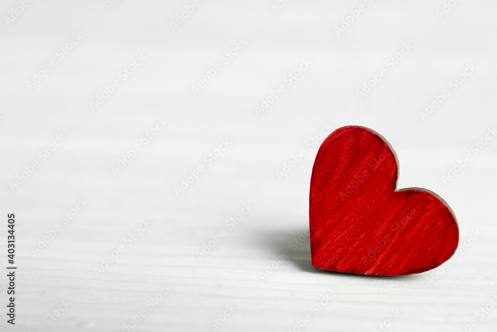 Fototapeta premium Decorative heart on white wooden table, space for text. Valentine's Day