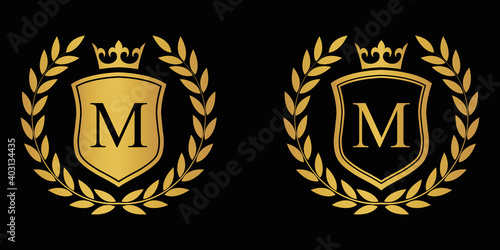  Letter M golden laurel wreath template logo Luxury shield letter with crown. Monogram alphabet . Beautiful royal initials letter.