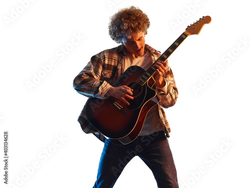one young caucasian man guitar player in studio shadow silhouette isolated on white background