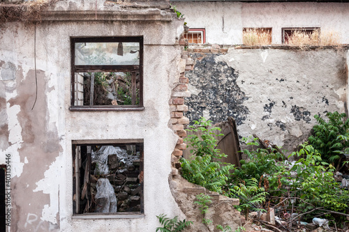 Outdoor facade of the ruins of a demolished residential building decaying in an urban environment in Belgrade, Serbia, 