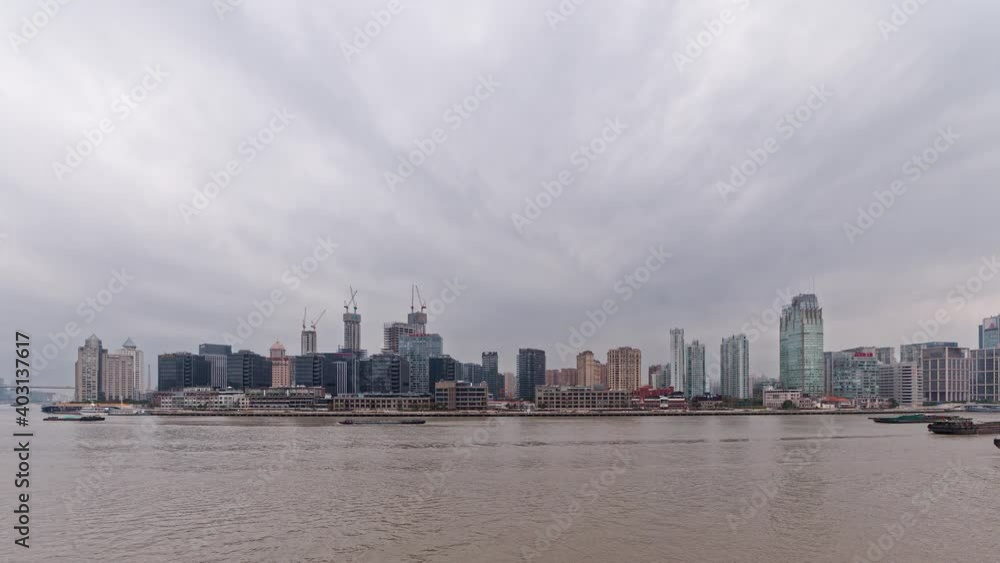 beautiful Shanghai Cityscape with cloudy sky background, cargo ships sailing on Huangpu river, 4k footage, time lapse video, b roll shot. beautiful Shanghai Cityscape with cloudy sky background, cargo ships sailing on Huangpu river, 4k footage, time lapse video, b roll shot.