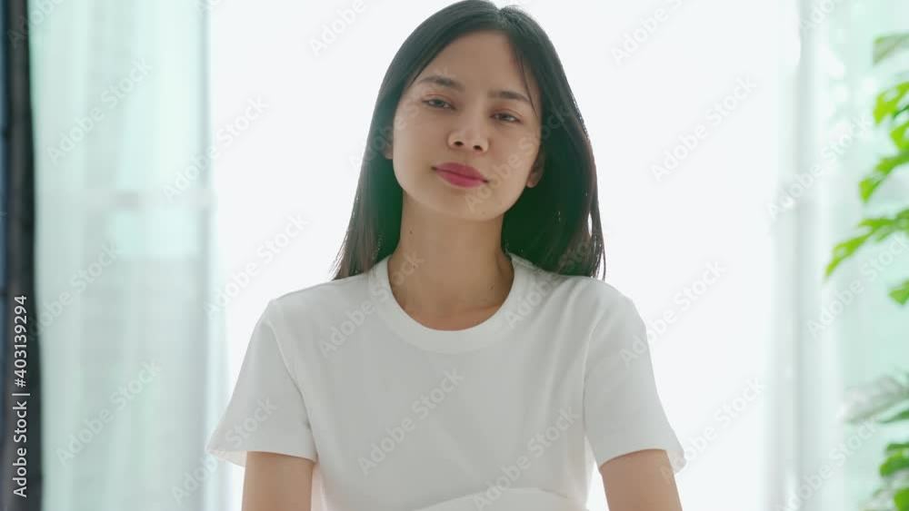 Beautiful Asian woman waking up in the morning in bed feeling happy. Beautiful Asian woman waking up in the morning in bed feeling happy.