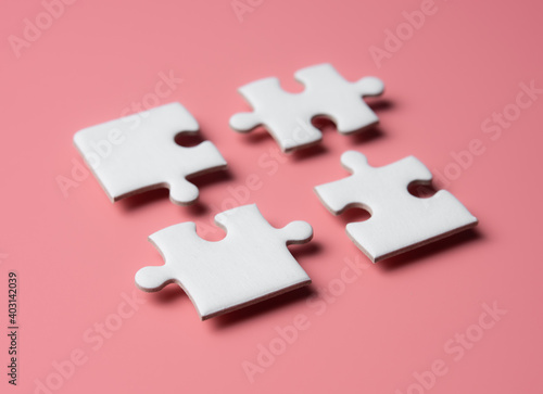 Four pieces of a puzzle,solving problems in business,Innovation and teamwork in company. photo