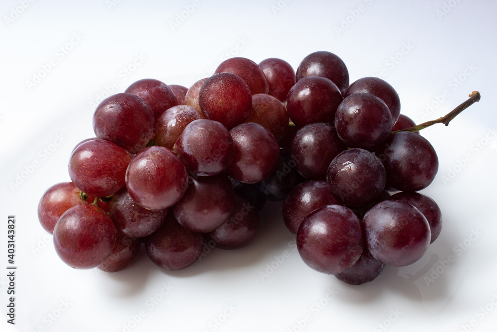 Bunch of red globe grapes isolated on white background Bunch of red globe grapes isolated on white background