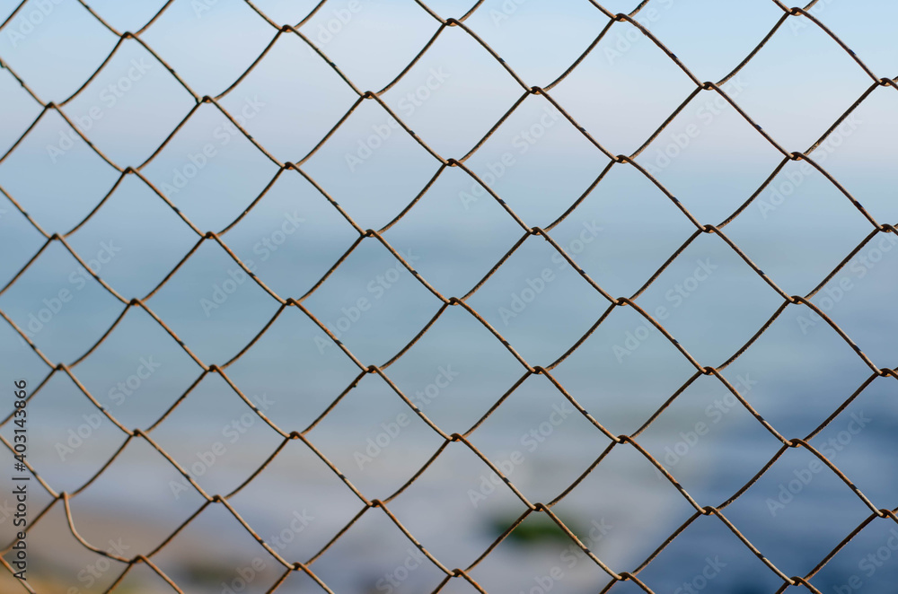 Fototapeta premium Rusty, metal mesh. Steel wire. Mesh fence.