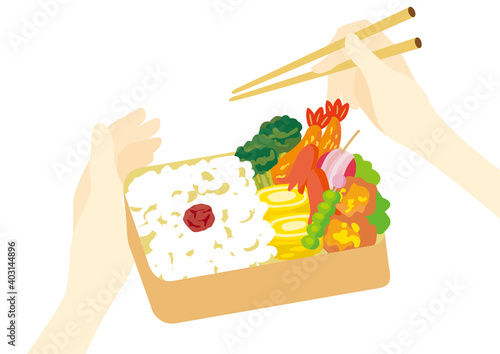 箸を使ってお弁当を作る手