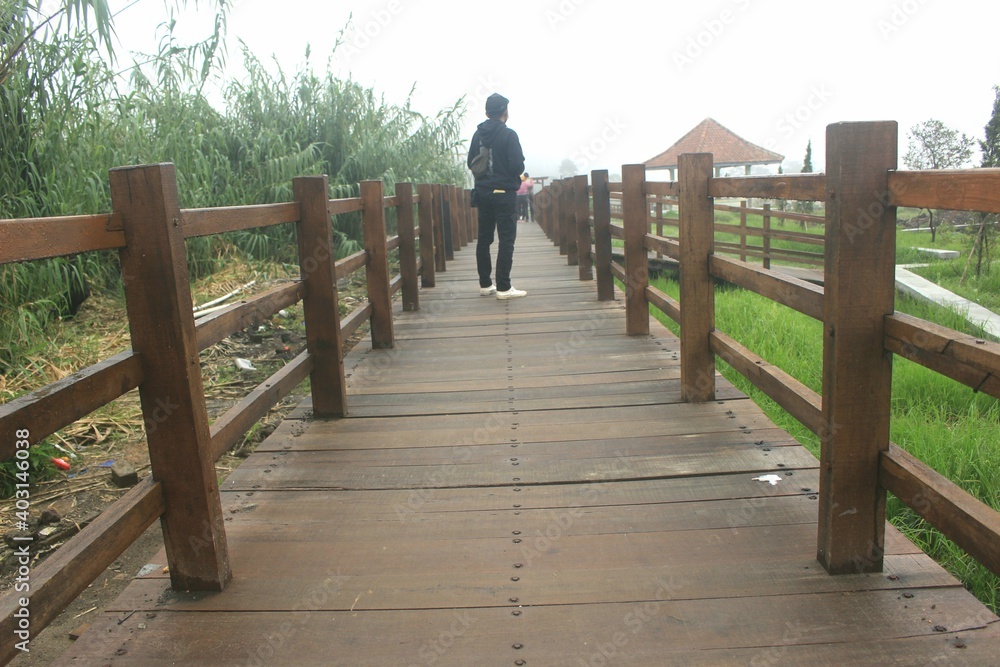The newest tourist spot of the Kahyangan Bridge from the Sikidang Crater tourist attraction. Dieng Indonesia The newest tourist spot of the Kahyangan Bridge from the Sikidang Crater tourist attraction. Dieng Indonesia