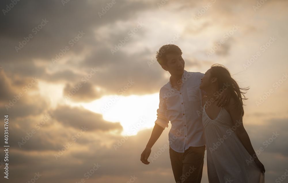 Portrait beach vacation romantic walk couple relaxing on ocean summer travel destination.Young couples are having fun on the beach.Summer in love,Valentine day concept.