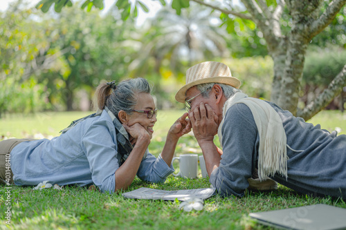 Senior, couples, retirement, insurance, elderly, lifestyle concept..Senior couples talking on the outdoor lawn in the morning about life insurance plans with a happy retirement concept.