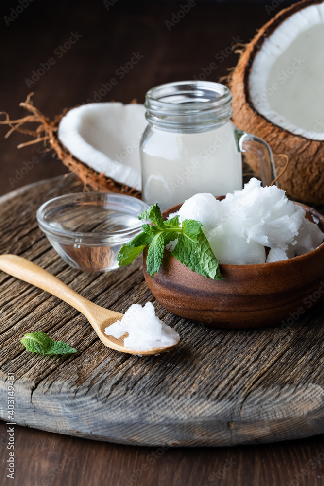 Close up view of coconut oil with MTC oil or medium chain triglycerides and coconut water. Healthy fat concept.