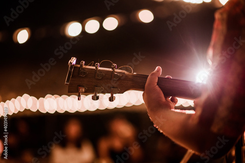 Musicians playing guitar at music festivals, lights, music, concerts, mini concerts. music festivals