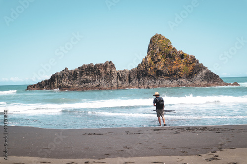 person walking on the beach