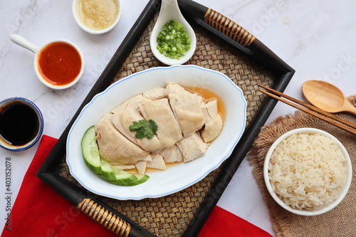Hainanese Chicken over the fragrant oily rice and three kind of sauces - Famous Singaporean food and in Thai called Khao Mun Gai at top view