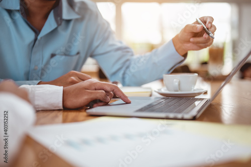 Businessman discussing new project or online data,Strategy Department in corporate brainstorming at meeting room.Business meeting concept.