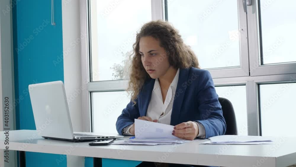 overload, stress - young accountant swears because the accounts don't add up overload, stress - young accountant swears because the accounts don't add up