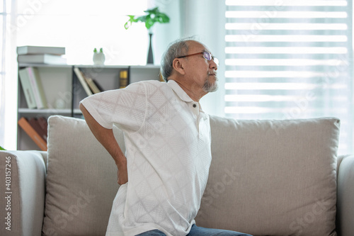 Asian Elderly senior man back pain and illness