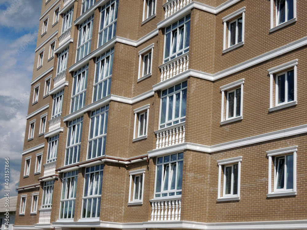 lower floors of a high-rise brick residential building