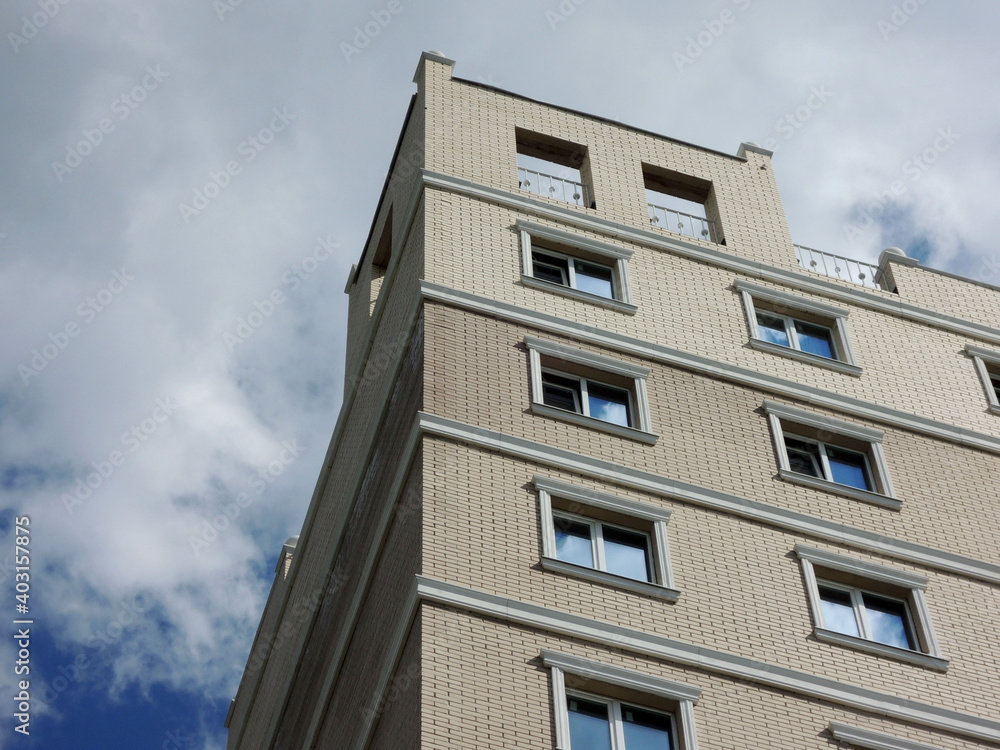 upper floors of a high-rise brick residential building upper floors of a high-rise brick residential building