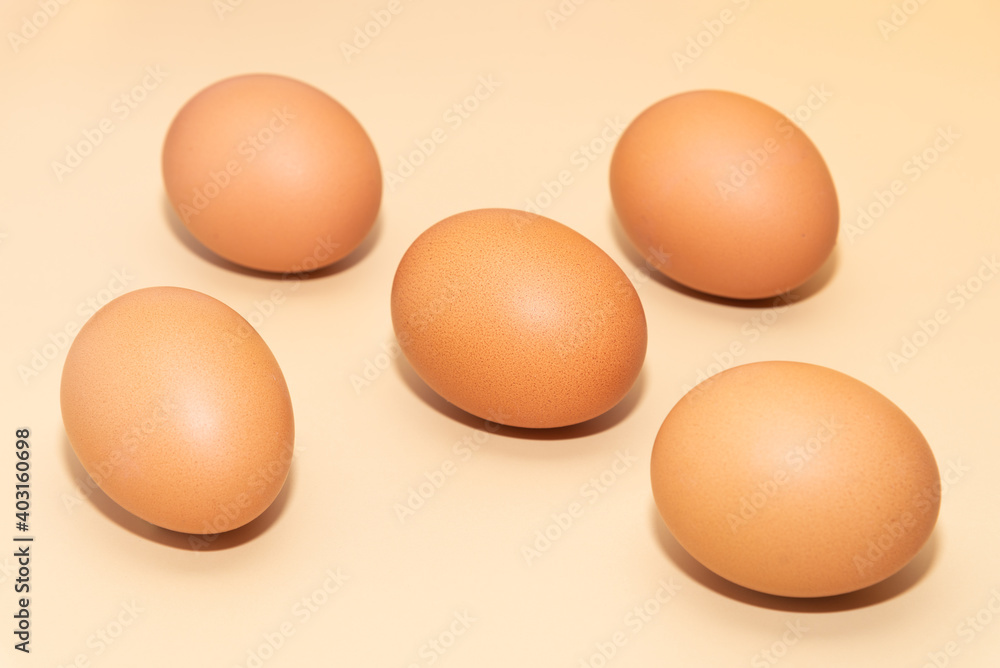 Five brown eggs on a simple background. Five brown eggs on a simple background.