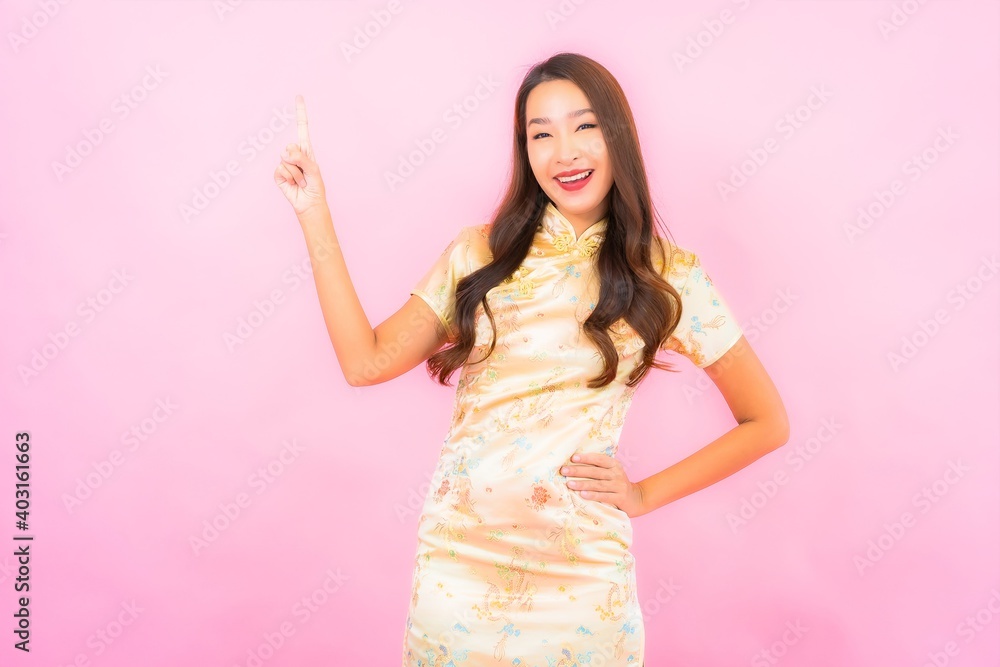 Portrait beautiful young asian woman smile in action with chinese new year concept Portrait beautiful young asian woman smile in action with chinese new year concept