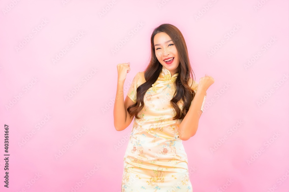 Portrait beautiful young asian woman smile in action with chinese new year concept Portrait beautiful young asian woman smile in action with chinese new year concept