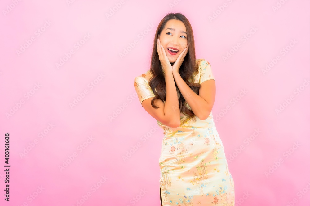 Portrait beautiful young asian woman smile in action with chinese new year concept Portrait beautiful young asian woman smile in action with chinese new year concept