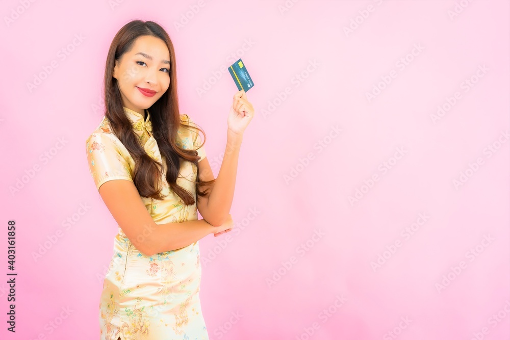 Portrait beautiful young asian woman with credit card and mobile phone Portrait beautiful young asian woman with credit card and mobile phone