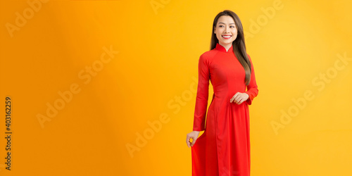 Принти на полотні Vietnamese beautiful women in the red gulf of Vietnam traditional dress