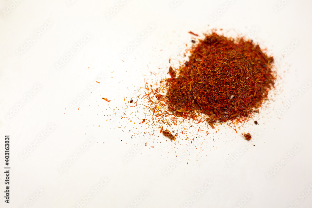 Dry saffron. Spices for dishes. White background. Dry saffron. Spices for dishes. White background.