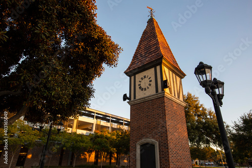 Sunset view of the public clock tower in the Civic Center of Westminster, California, USA.