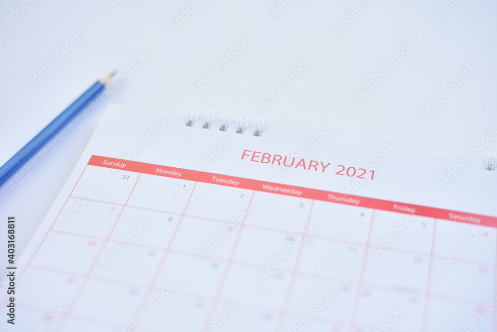 White calendar on white table.