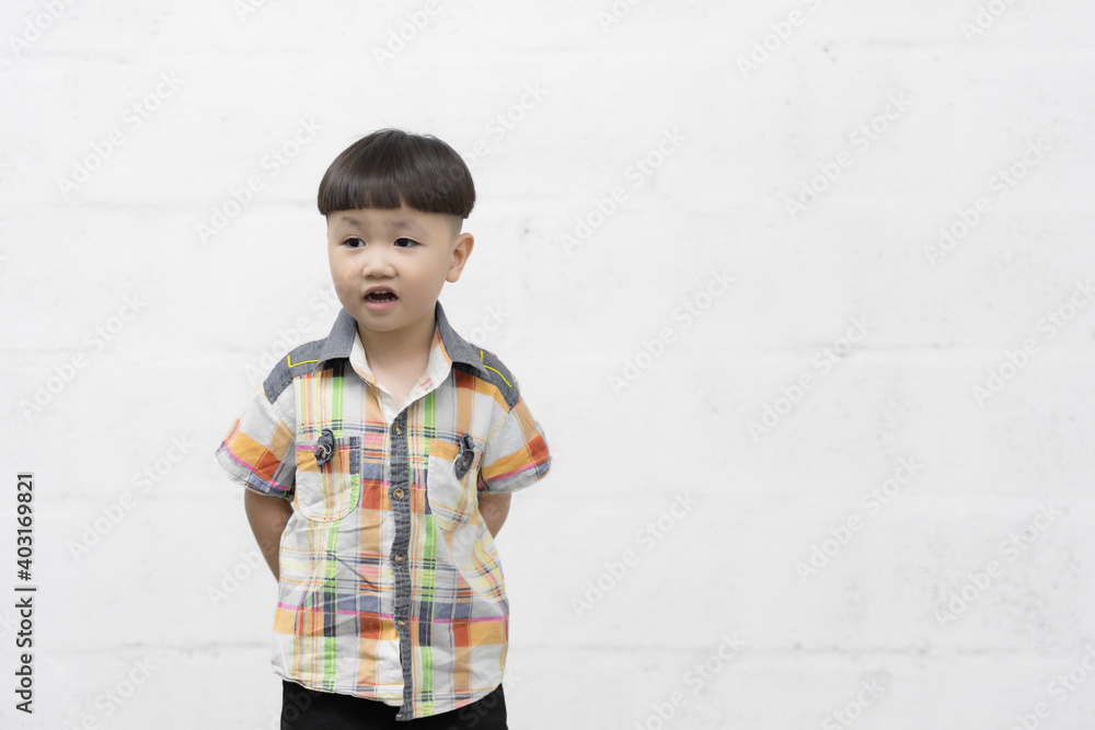 Studio shot portrait of happy little Asian boy on background Studio shot portrait of happy little Asian boy on background