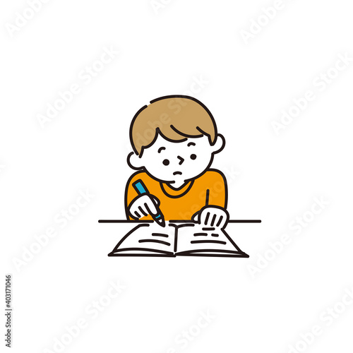 机に向かって勉強をする男の子