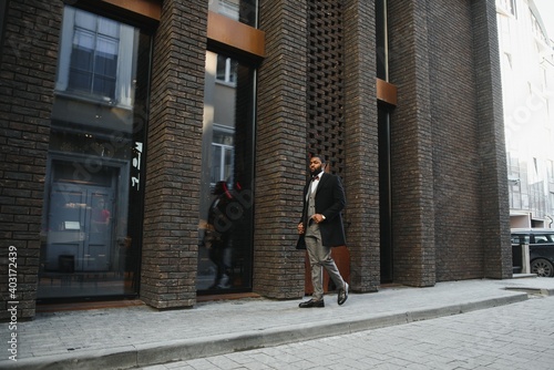 Wallpaper Mural Portrait of an handsome businessman walking in a business environment Torontodigital.ca