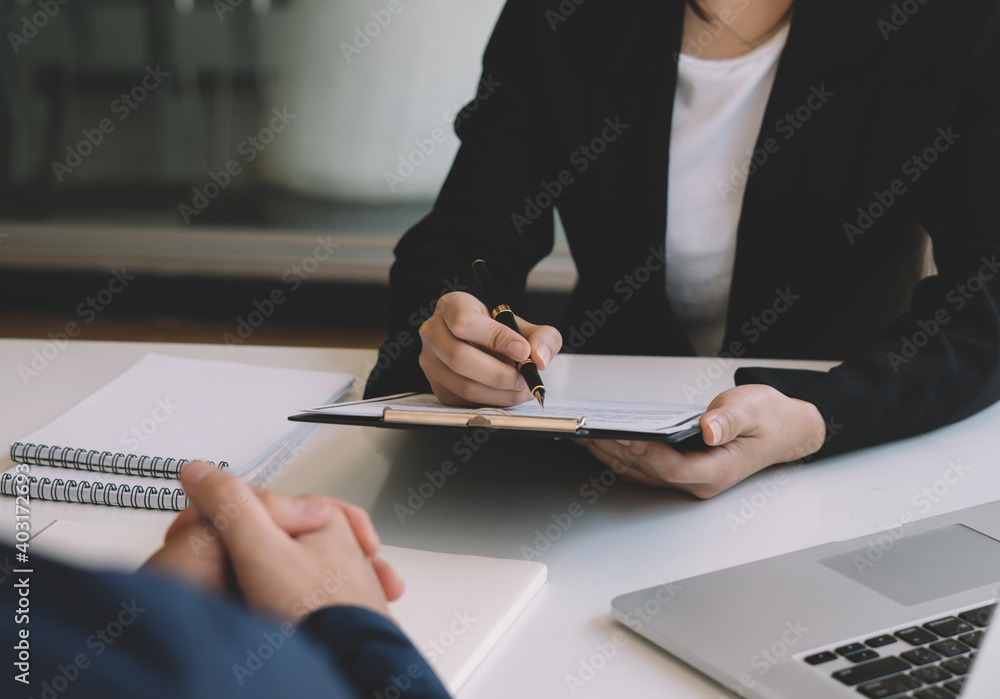 Management members checking candidate's resume after recruitment review Management members checking candidate's resume after recruitment review