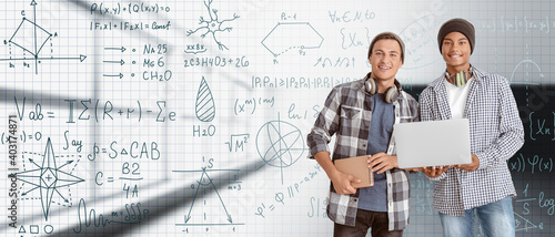 Young men with laptop study...