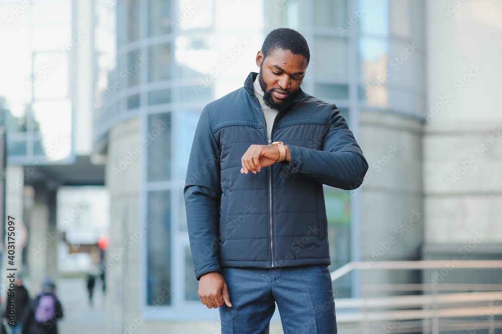 African American man in stylish new clothes on the street African American man in stylish new clothes on the street
