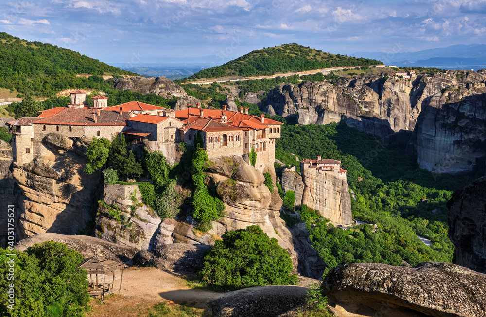 Cliff top Varlaam monastery, Meteora, Greece, typical landscape, rocky pillars. Moni Agias Varvaras Roussanou nunnery below. UNESCO World Heritage