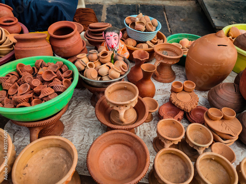 Clay oil lamps  small pots  jars kept on hand cart for sale in Indian street market