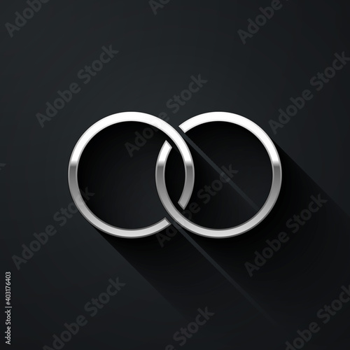 Silver Wedding rings icon isolated on black background. Bride and groom jewelry sign. Marriage symbol. Diamond ring. Long shadow style. Vector.