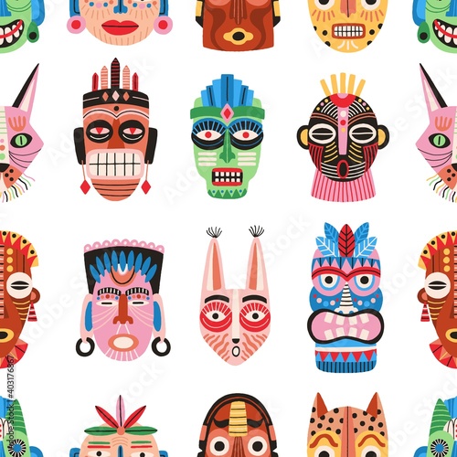 Traditional ritual or ceremonial tribal masks vector flat illustration. Colorful shapes of human face or animal's muzzle seamless pattern. Ethnic decorative masquerade attribute wallpaper template